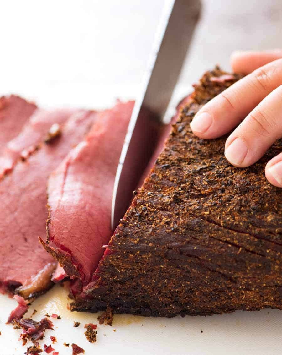 Easy homemade pastrami being sliced