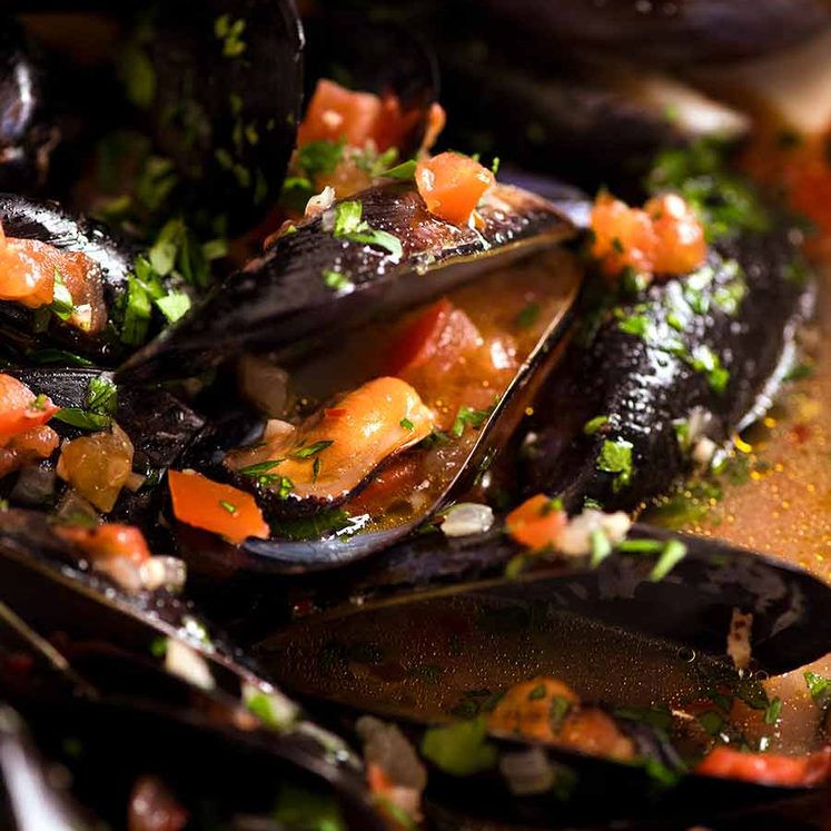 Close up of mussels with garlic white wine
