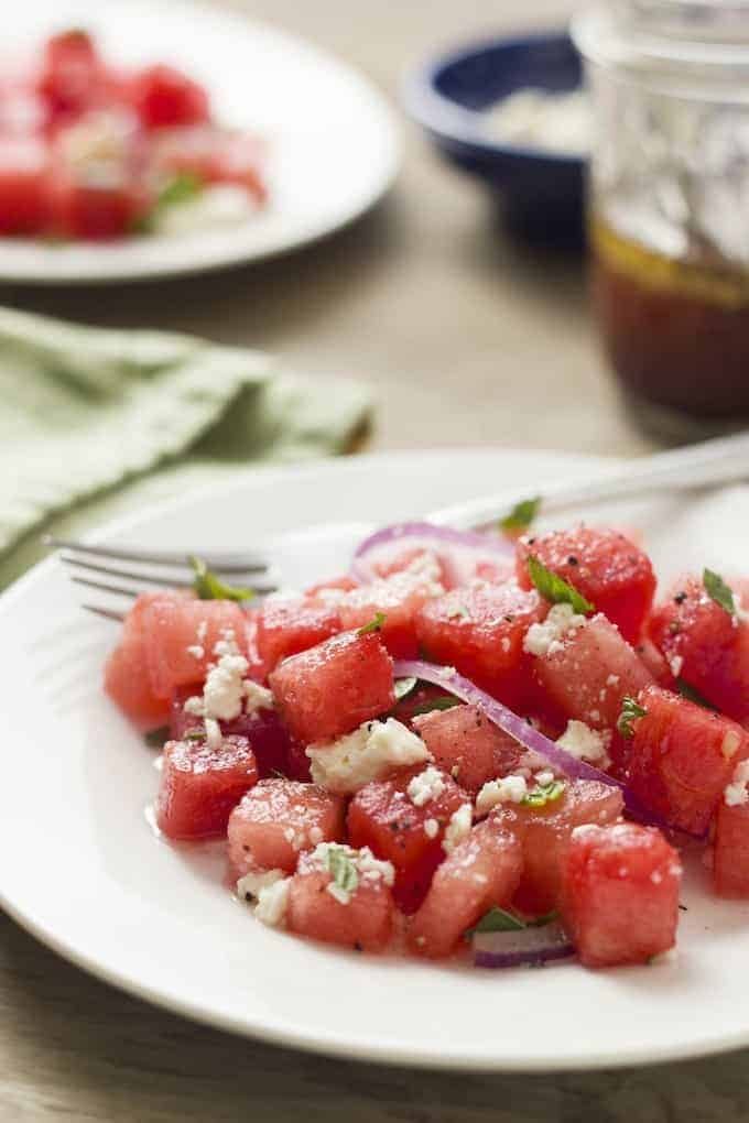 Watermelon Salad - as strange as it sounds, sweet, juicy watermelon with feta, red onion and mint is a winning combination. This summery, light salad is refreshing and is perfect for a summer barbeque.