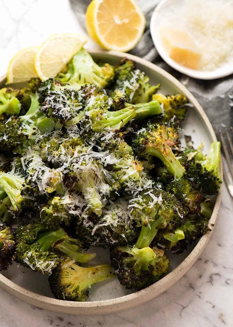 Magic Broccoli - the best roasted broccoli ever - on a white plate, ready for serving