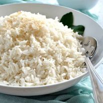 Fluffy coconut rice in a white bowl, ready to be served.