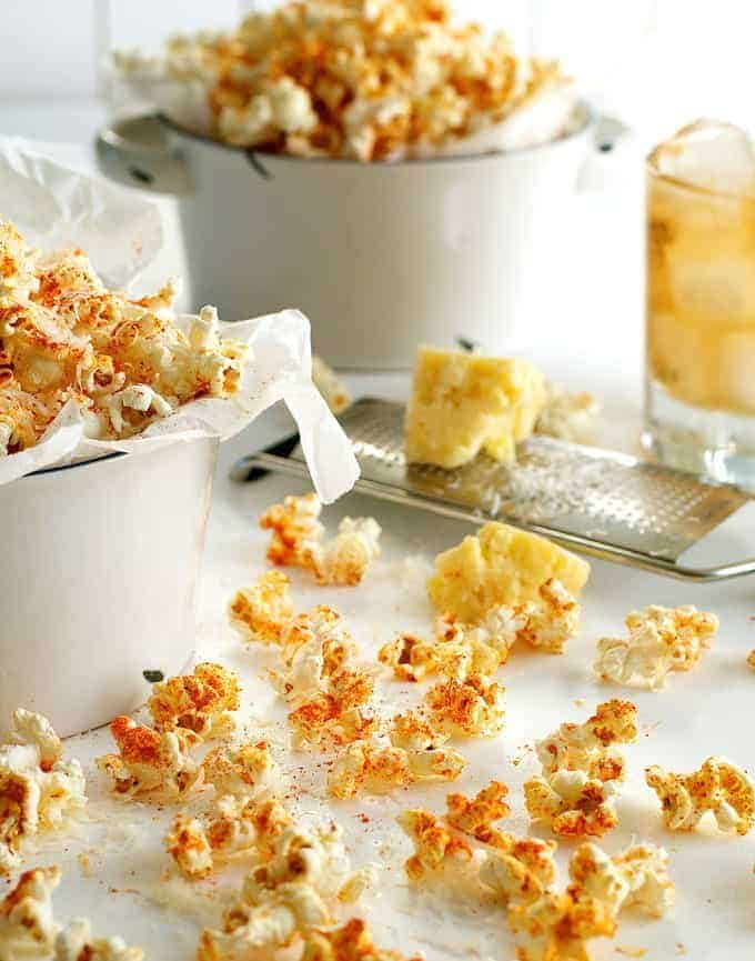 Spicy Parmesan Party Popcorn scattered on a table