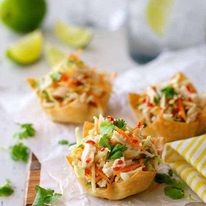 A serving board of Thai Chicken Salad Wonton Cups