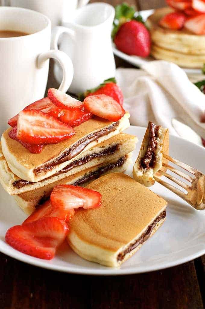 Nutella Pancakes - frozen Nutella discs makes it a breeze to make these Nutella stuffed pancakes! recipetineats.com