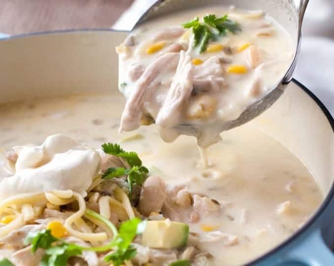 White Chicken Enchilada Soup - tastes like White Enchiladas, but in soup form! Creamy with a tiny touch of tang, so luscious and satisfying. #leftoverturkey #thanksgivingleftovers #turkey
