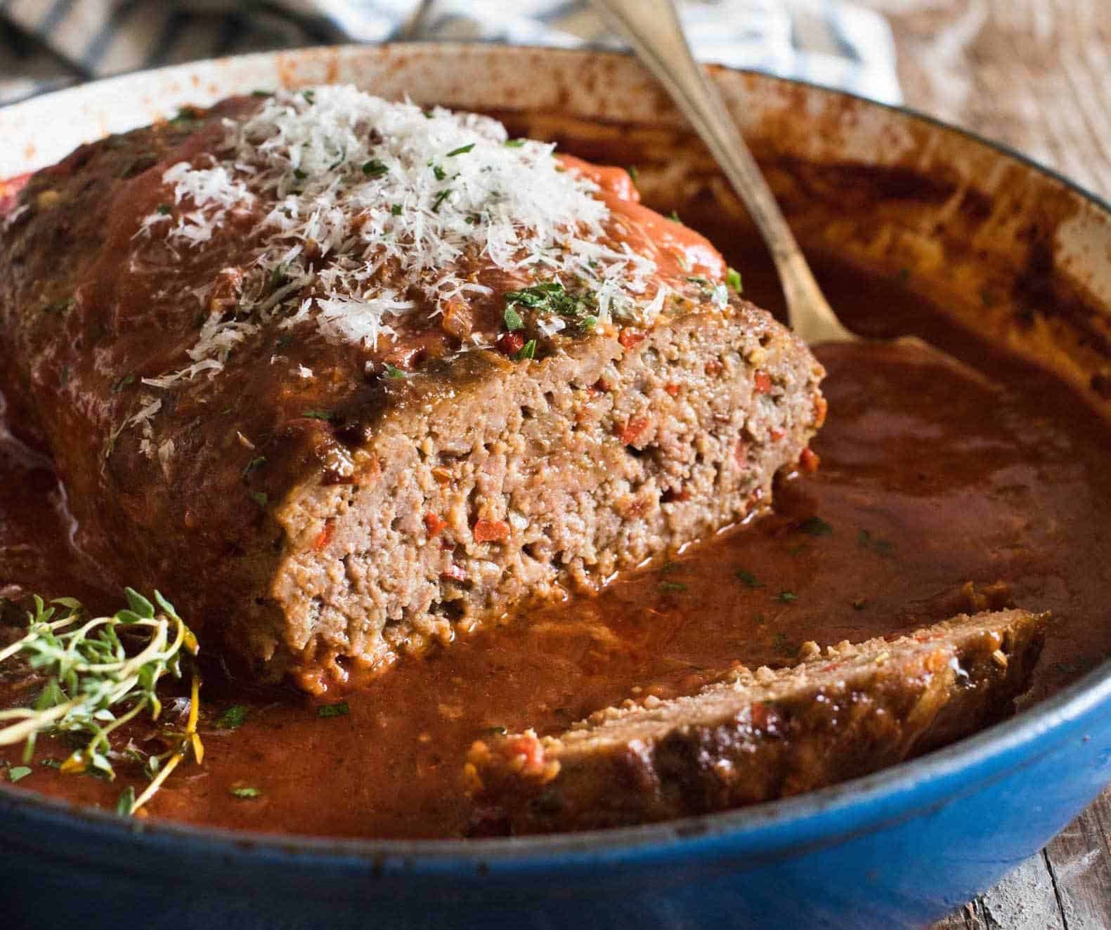 Italian Meatloaf in sauce topped with parmesan cheese