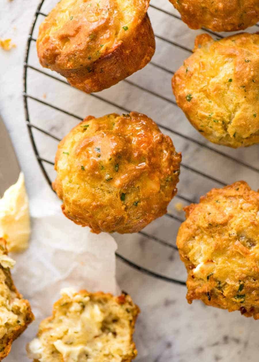 Overhead photo of Savoury Cheese Muffins cooling on a baking rack, fresh out of the oven.