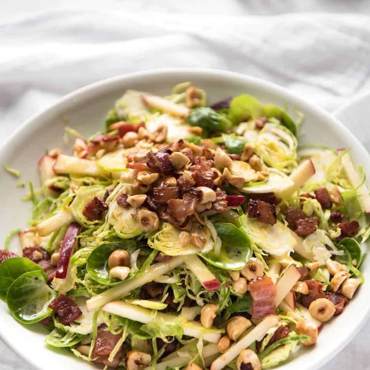 Brussel Sprout Salad - the combination of brussels sprouts, bacon, apple and hazelnuts is a magical combination! recipetineats.com