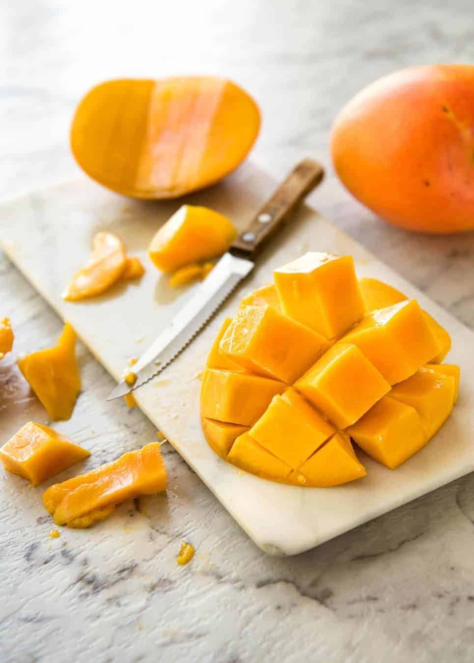 Mango cheek cut into a "hedge hog"