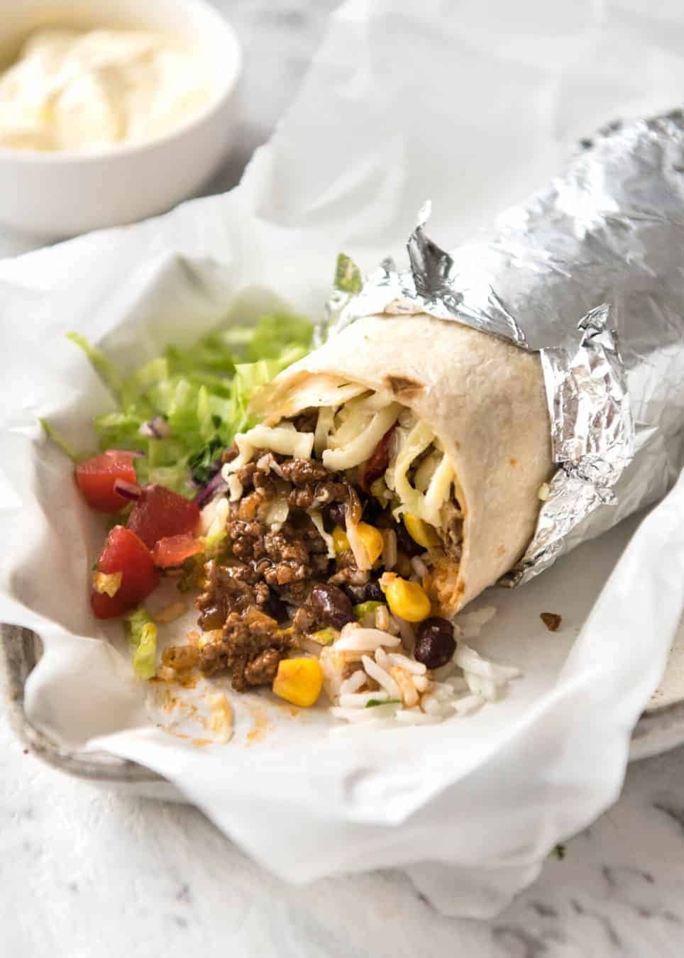 A great everyday Beef Burrito, made with super tasty seasoned beef filling. Fresh and freezable versions! www.recipetineats.com