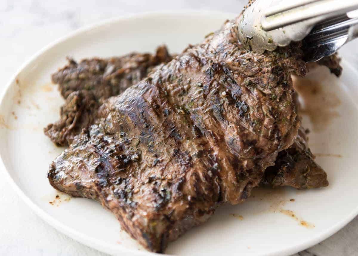 Carne Asada grilled to perfect, pink inside, marinated in a citrusy, garlicky authentic Carne Asada marinade. recipetineats.com