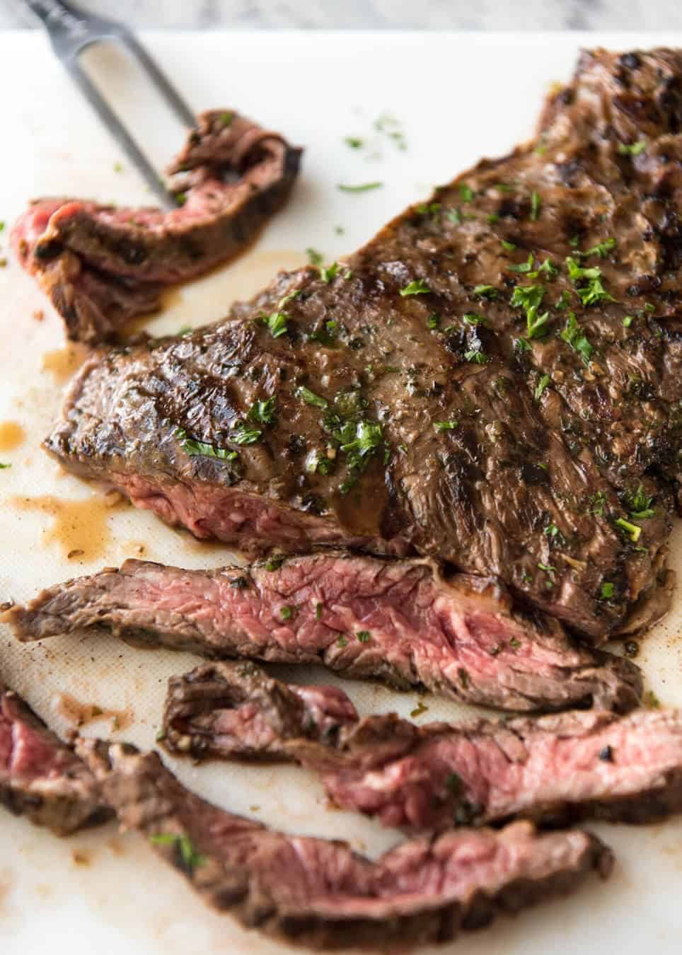 Carne Asada grilled to perfect, pink inside, marinated in a citrusy, garlicky authentic Carne Asada marinade. recipetineats.com