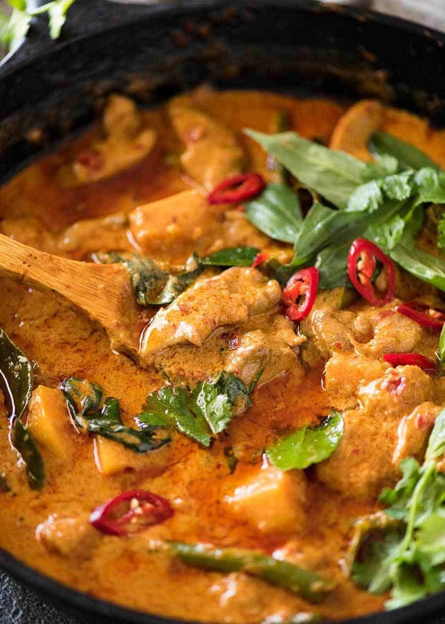 Thai Red Curry with Chicken in a skillet, fresh off the stove.