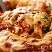 Close up of serving Baked Ziti fresh out of the oven