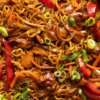Close up of Chicken Vegetable Ramen Noodles with capsicum / bell peppers, carrots, cabbage and chicken.