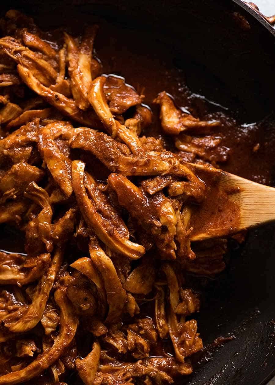 Mexican Shredded Chicken for Nachos in a black skillet