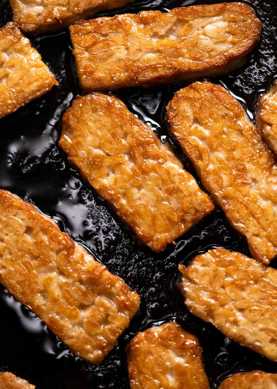 Close up of crispy pan fried tempeh