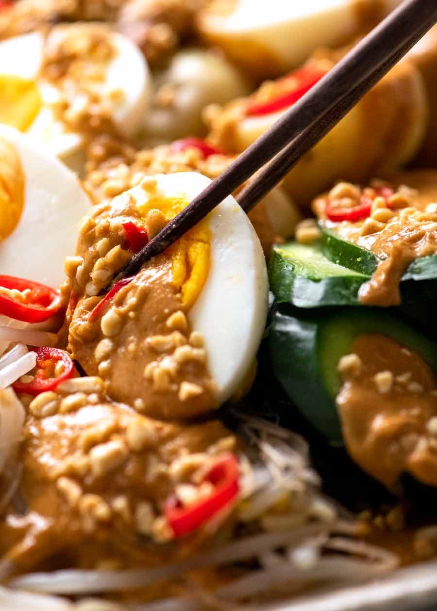 Close up of egg with Gado Gado peanut sauce