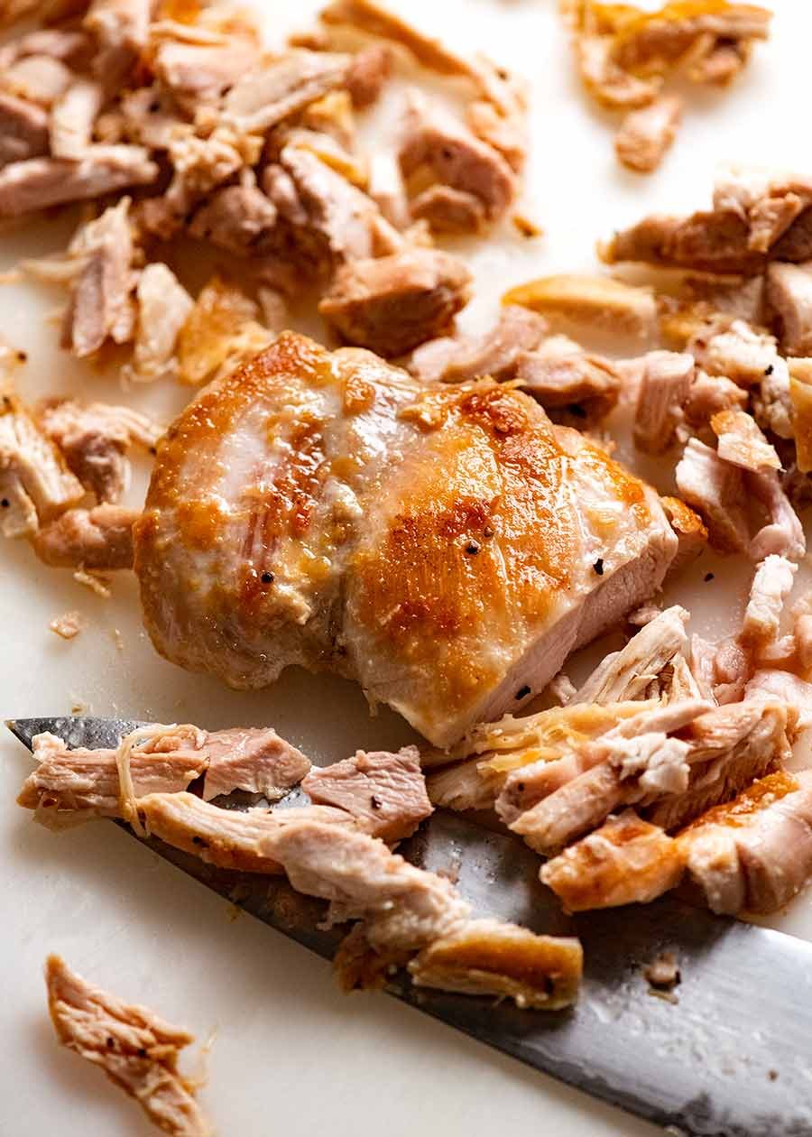 Close up of chopped pan seared chicken thighs
