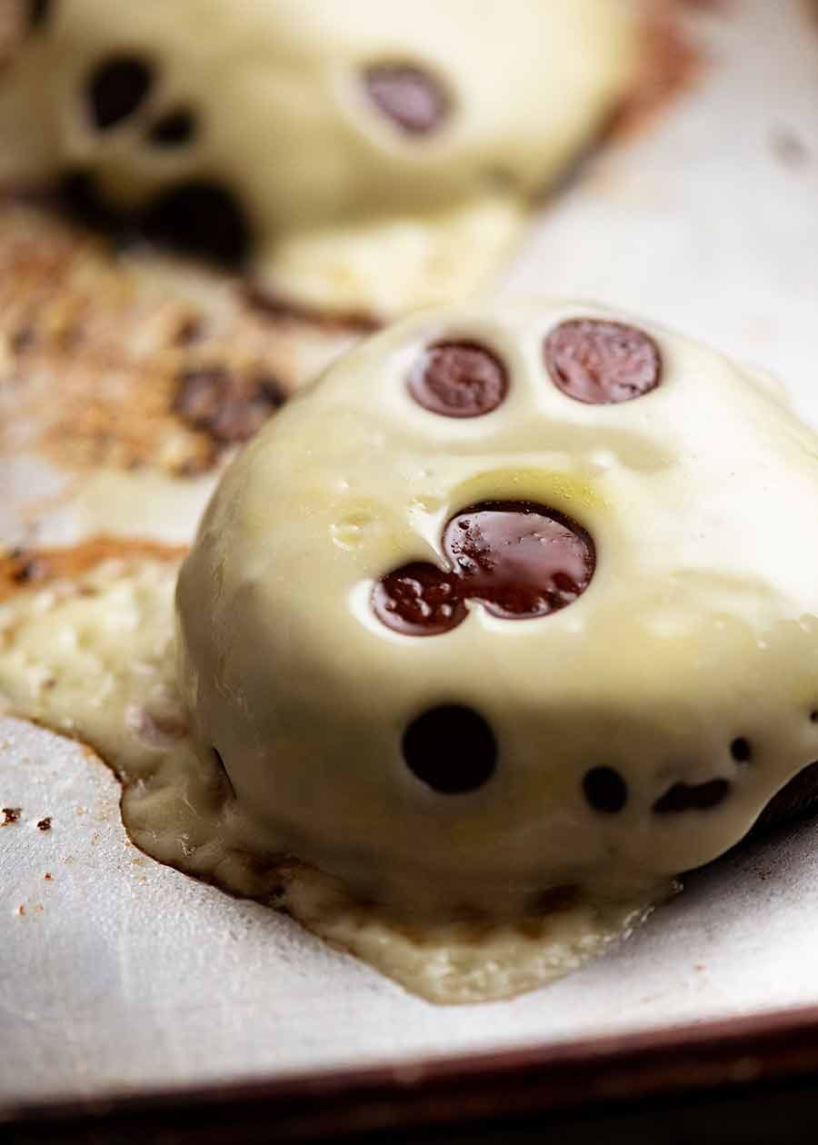 Swiss cheese melted on roasted mushroom for mushroom burgers