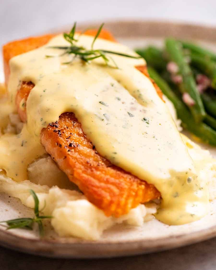 Salmon on a plate smothered in Bearnaise Sauce