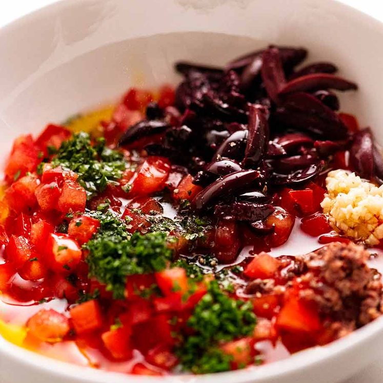 Sauce Vierge ingredients in a bowl
