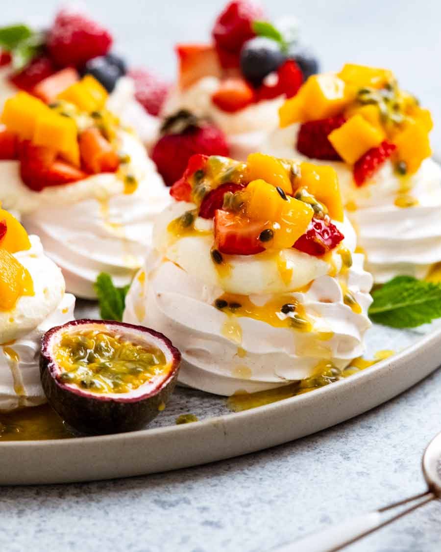 Close up of Mini Pavlovas with mango and passionfruit